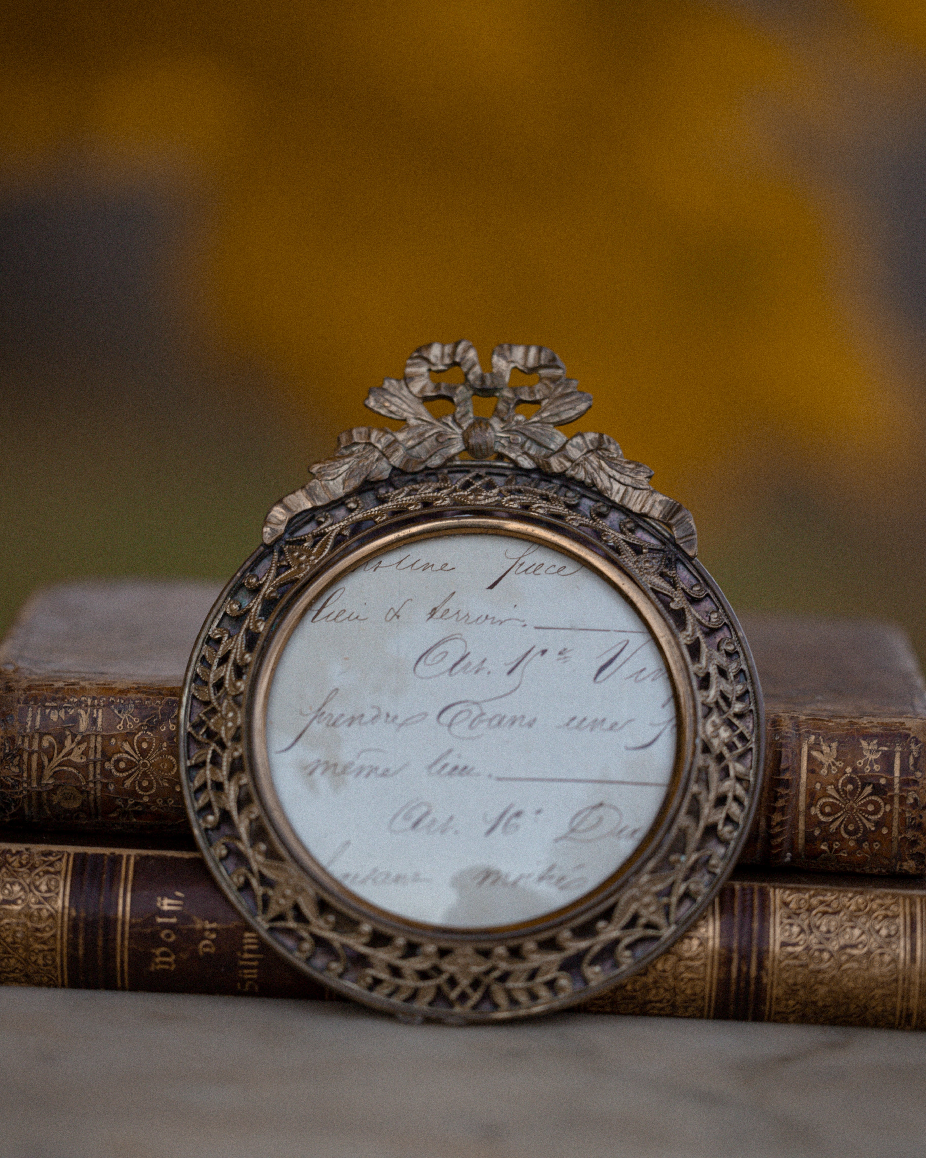 (A) Round Brass Frame w/ Bow Motif